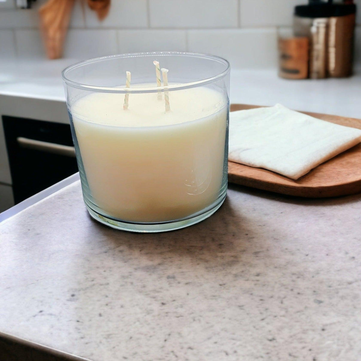 Gia 3-wick soy candle on a kitchen counter