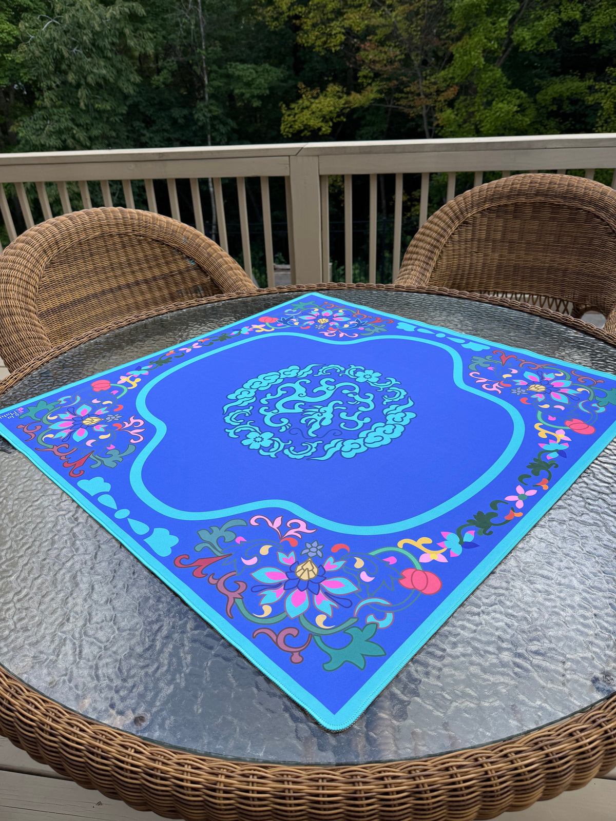 Brocade in Bloom mahjong mat on a game table