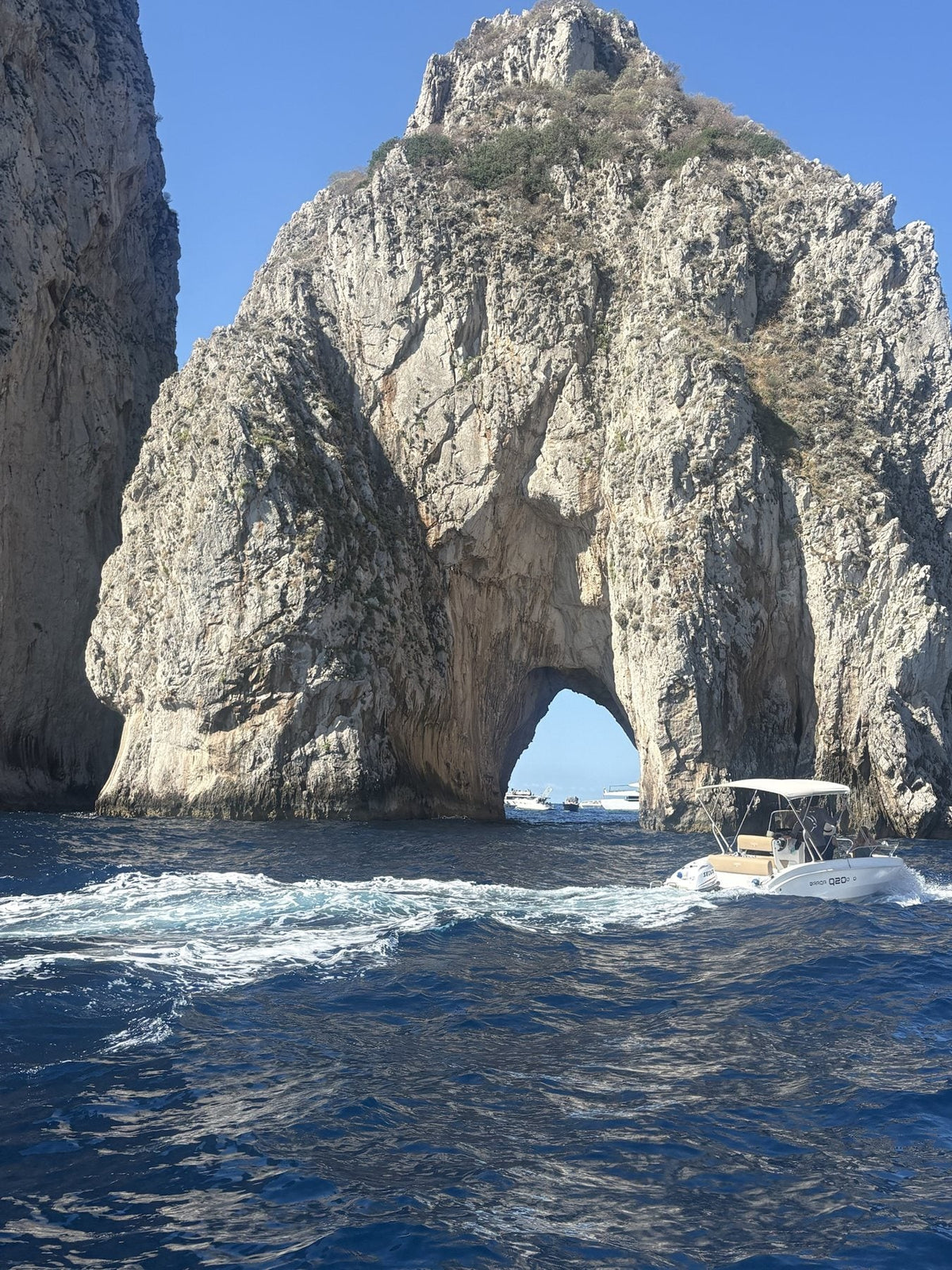 The sea arches of Capri over deep blue water