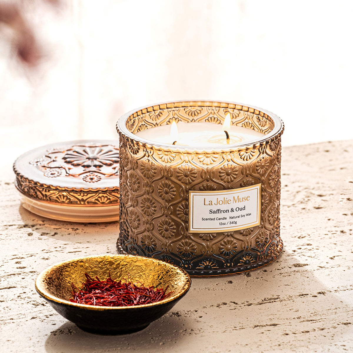 Saffron and Oud 12 oz luxury candle in embossed glass, view 3