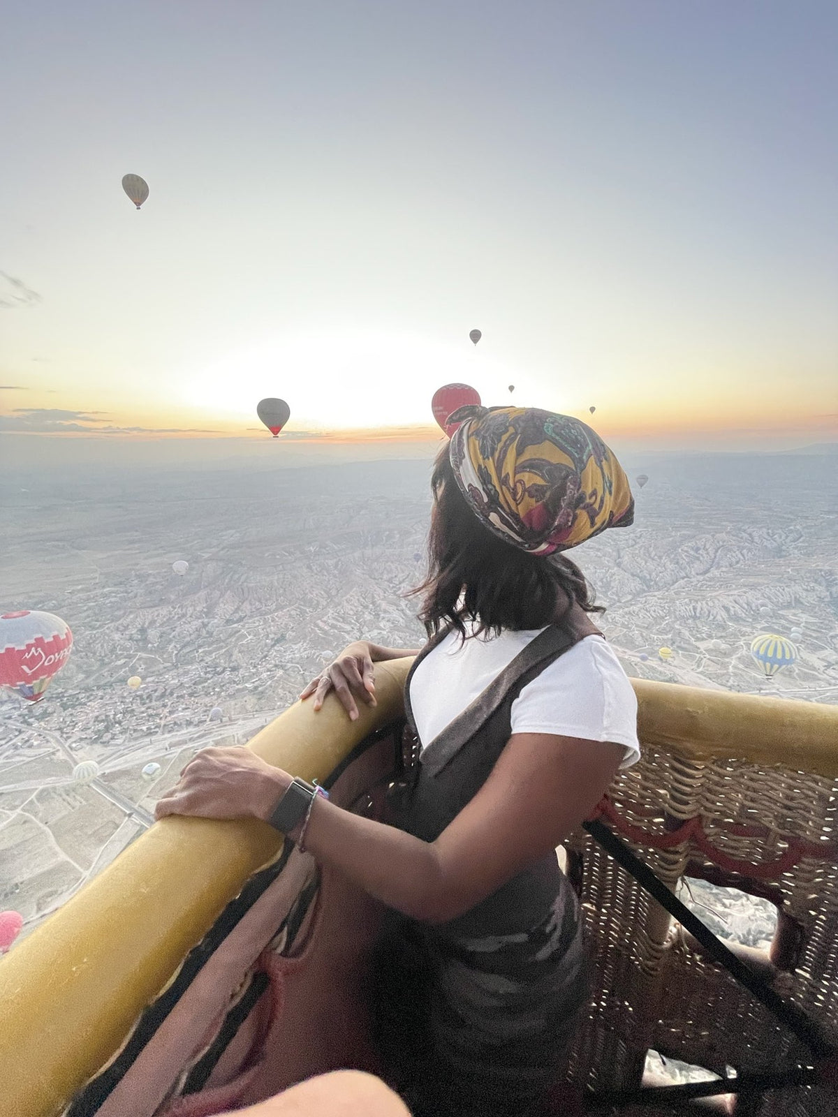 Watching hot air balloons rise at sunrise over Cappadocia